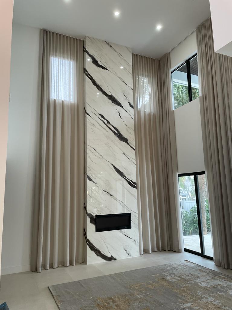 Two-story porcelain slab fireplace feature wall, Tampa Bay customer project by Floor Center of Tampa Bay
